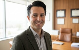 Confident man with natural-looking hair transplant results in modern medical office setting