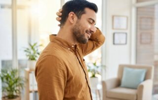 Man showing successful hair transplant donor area recovery with confident expression