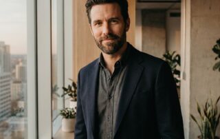 Confident man with natural-looking full hairline representing successful male hair restoration results