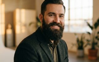 Confident man with a full, well-groomed beard — beard transplant for men with patchy facial hair