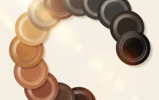 Color swatches arranged by skin tone spectrum representing scalp micropigmentation color matching by skin tone