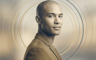Confident man with shaved head representing scalp micropigmentation fading touch up maintenance timeline