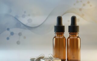 Topical finasteride dropper bottles beside oral capsules illustrating effectiveness comparison for hair loss treatment