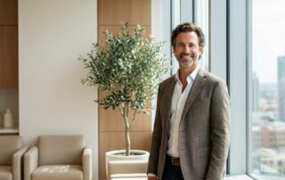 Confident man with natural hair restoration results at a modern hair clinic — INeedMoreHair website hair restoration information