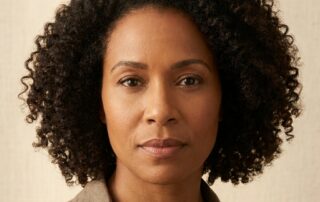 Confident woman with healthy restored hairline representing hope after hair transplant for traction alopecia from hairstyles
