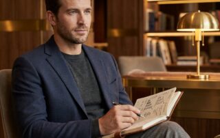 Confident man reviewing long-term cost comparison to evaluate if scalp micropigmentation cost is worth it