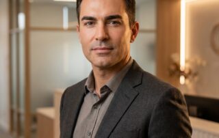 Confident man with naturally full, well-shaped eyebrows — eyebrow transplant results for men with thinning sparse brows