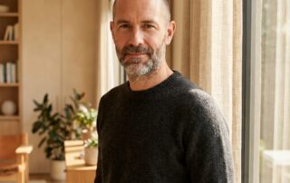 Confident man exploring Norwood scale 7 hair loss treatment options in a modern, calm setting
