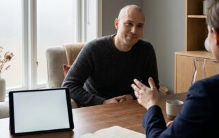 Man discussing micro scalp micropigmentation cost during a calm consultation