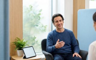 Confident man with healthy hair in a modern clinic, representing hair surgery transplant results